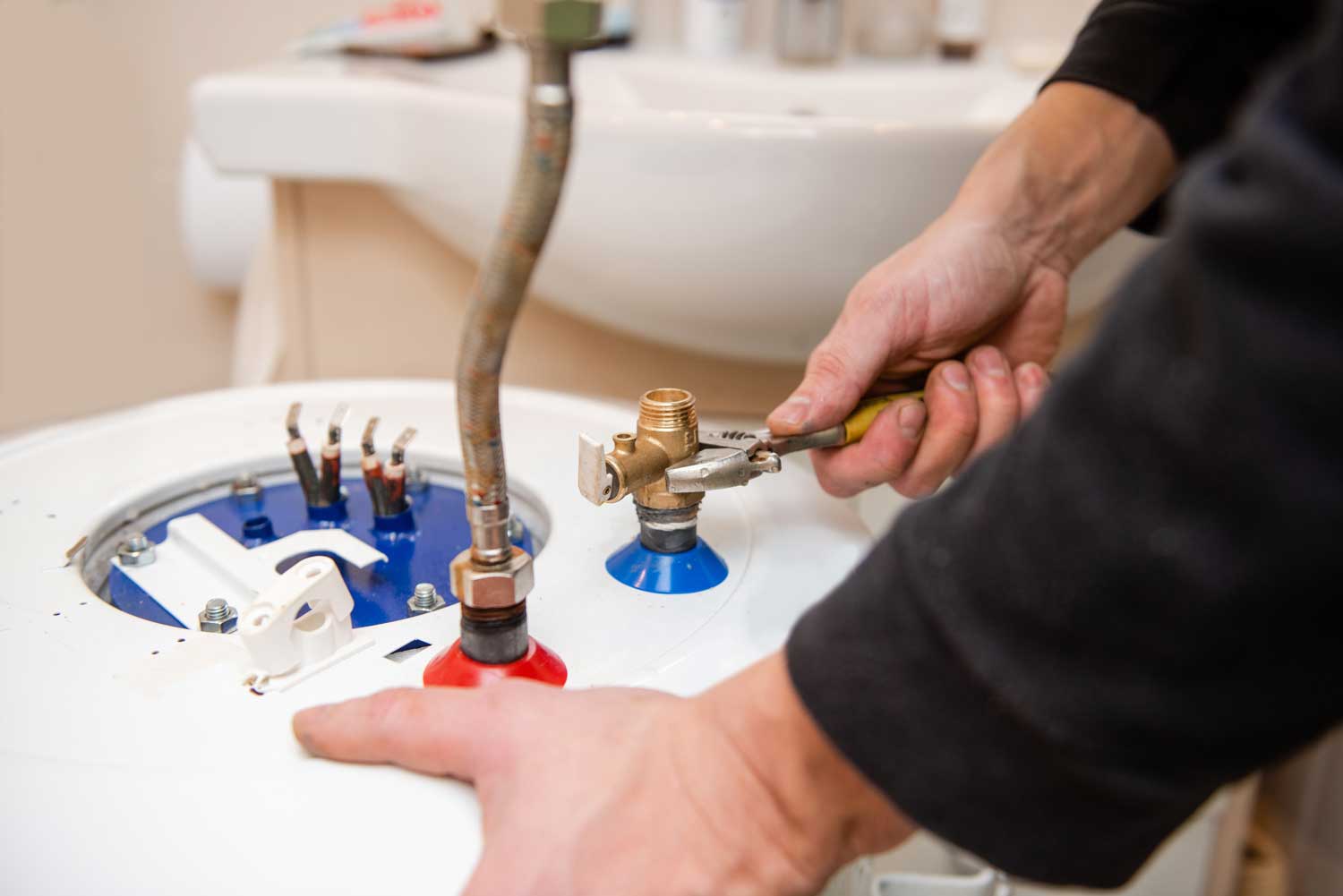 Technician installing a new water heater